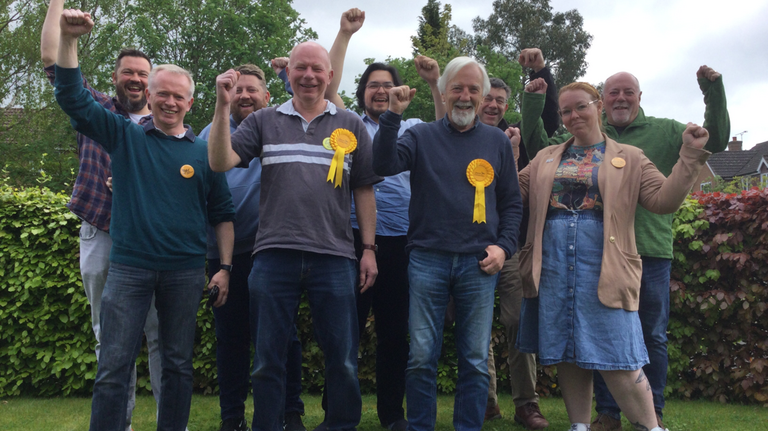 9 Lib Dems Cheering whilst outside